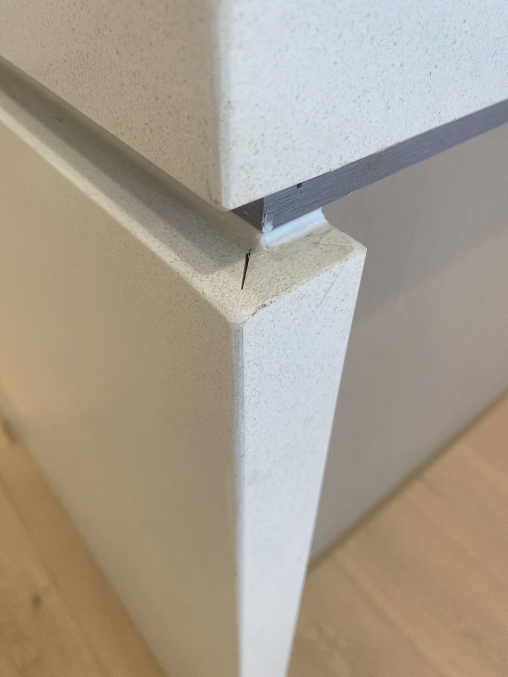 Benchtop join poorly finished and not sitting in one plane, found during a handover inspection in Tallawong