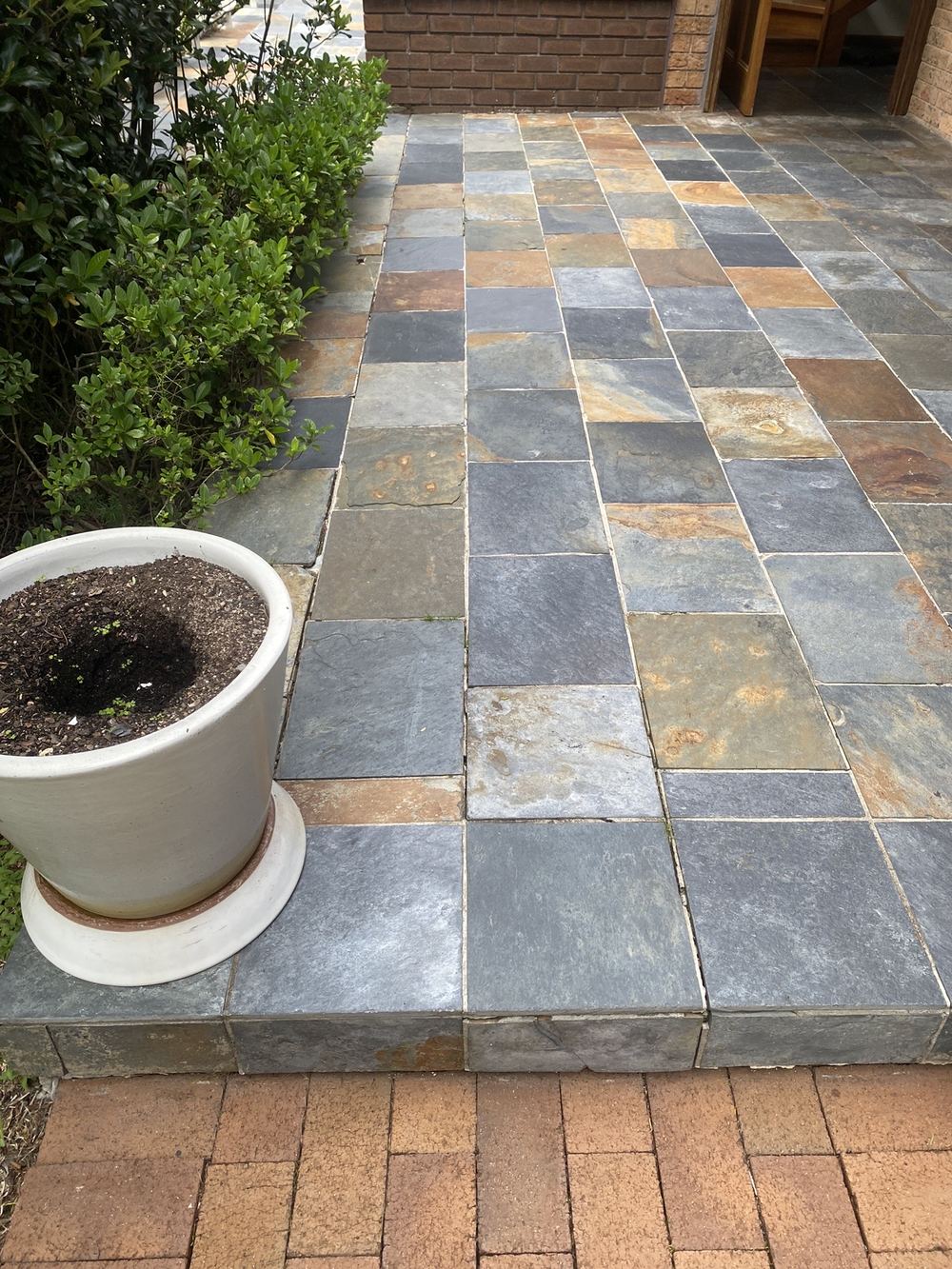 Front slab bowing, with grout lines cracking and lifting, found during a pre-purchase inspection in St Ives