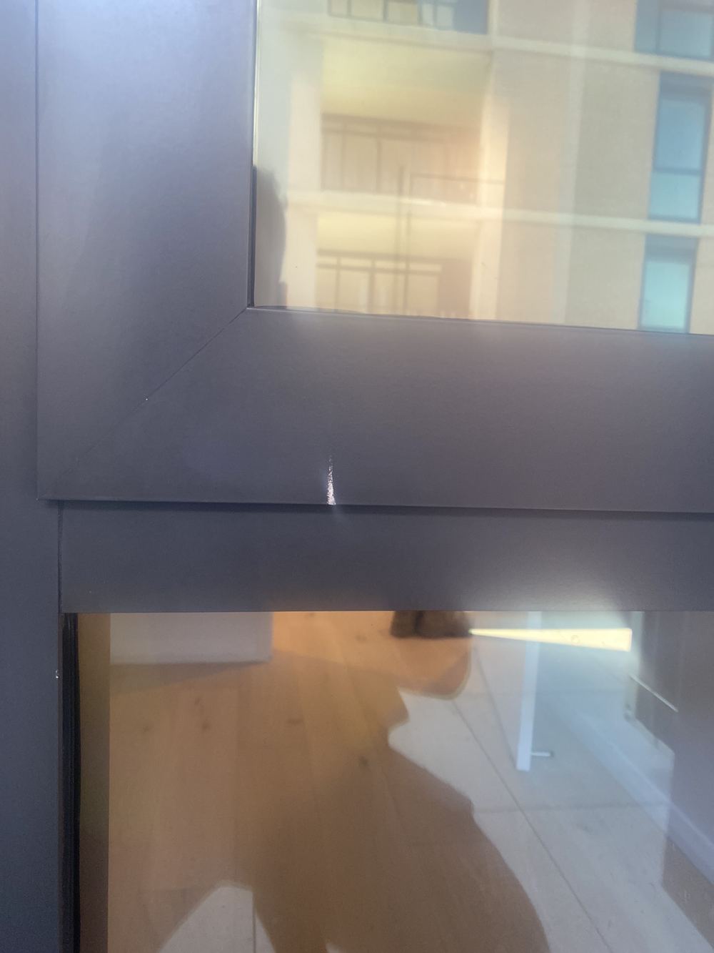 Dented and scratched aluminium window frame, Tallawong